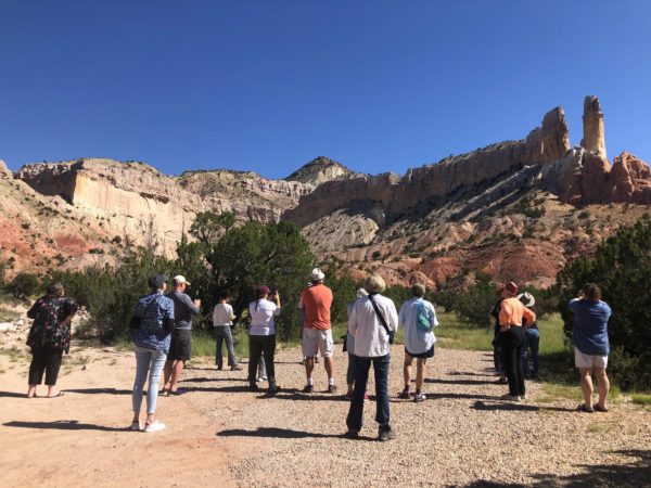group of people taking a gander at the montain